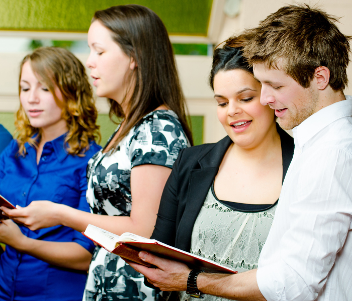 congregation singing from hymnals